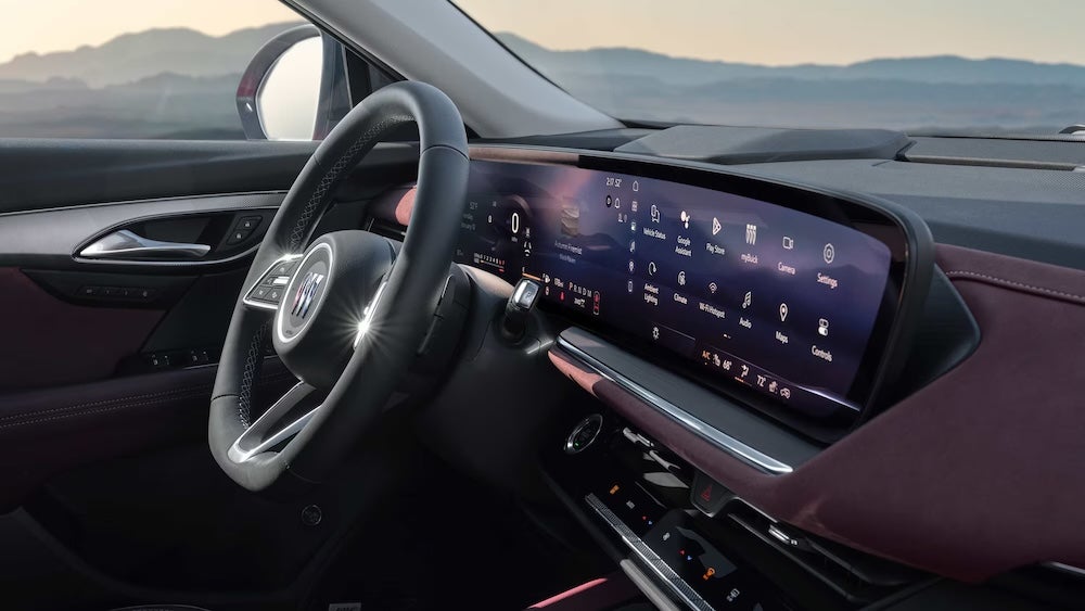 The dash of the 2026 Buick Envision SUV, with steering wheel and touchscreen display in view
